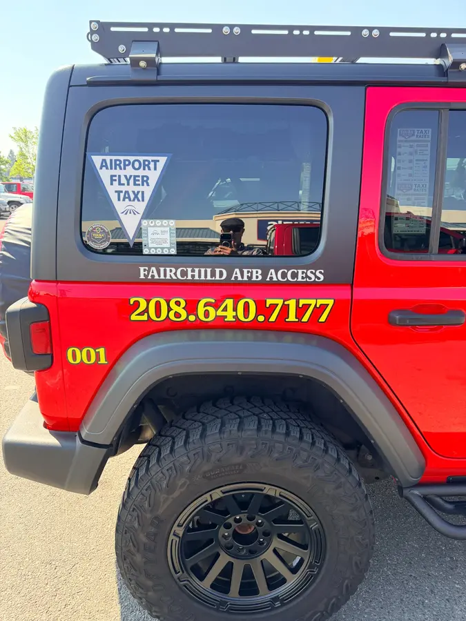 Airport Flyer Taxi and Fairchild AFB Access decals on TOURA Jeep 001